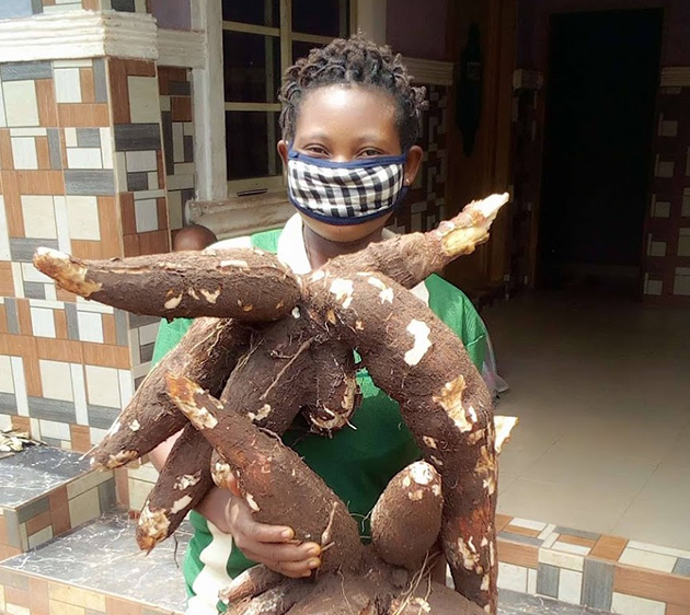 child holding cassava